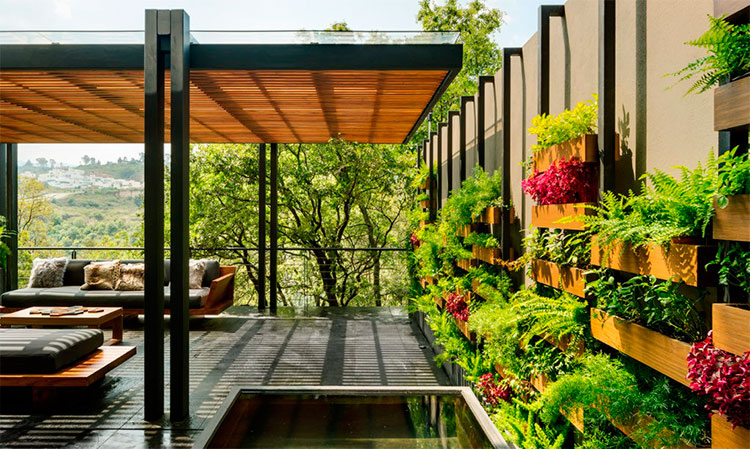 Una casa que invita a la naturaleza a entrar en los ambientes - Condomínios  Verdes